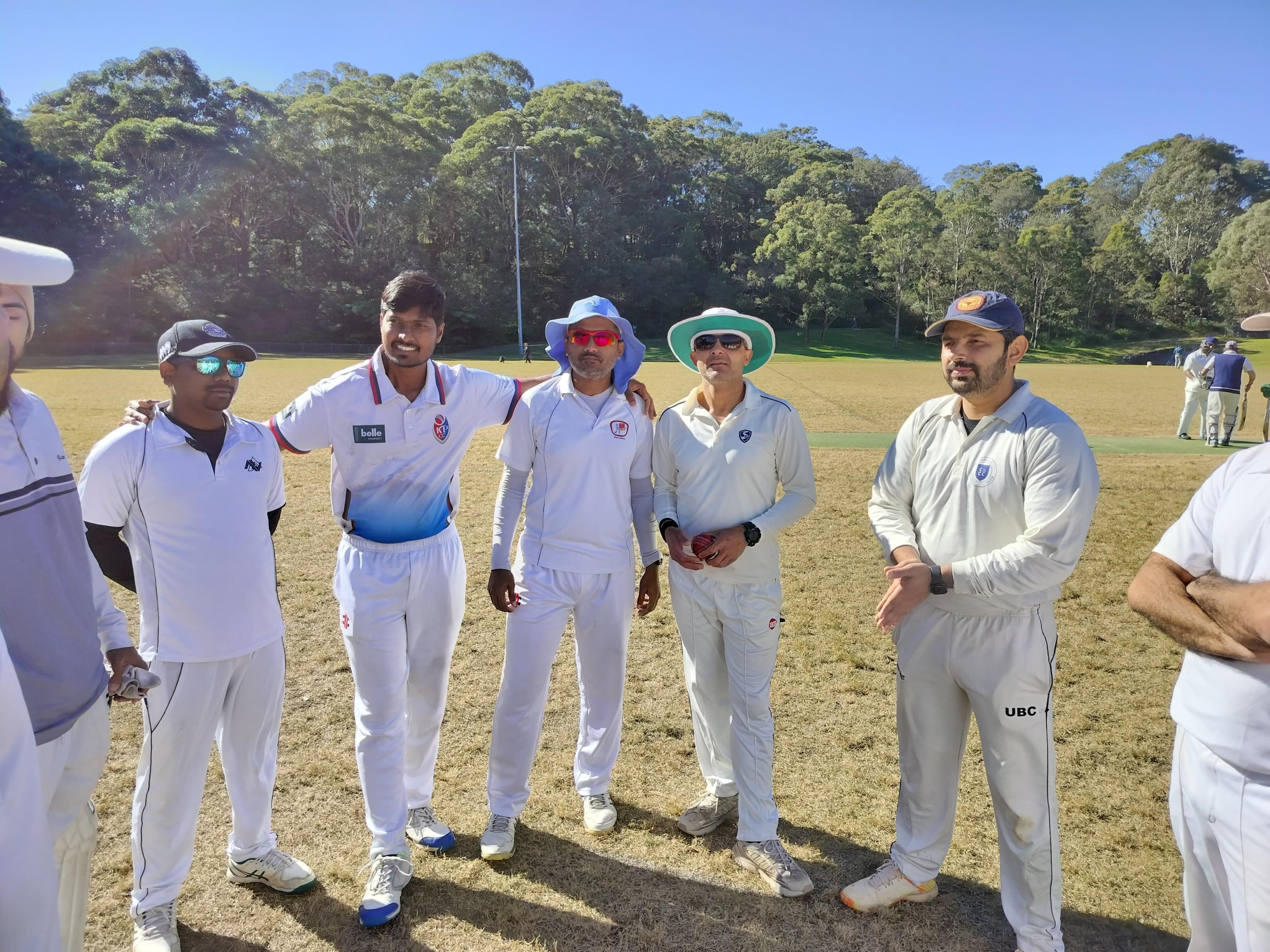 Hornsby Tigers players gathered together on the ground after a match